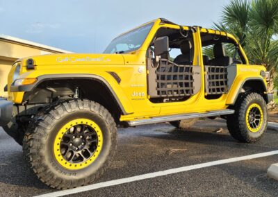 yellow jeep wrangler side view