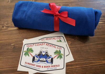 gulf coast rental sticker and beach towel