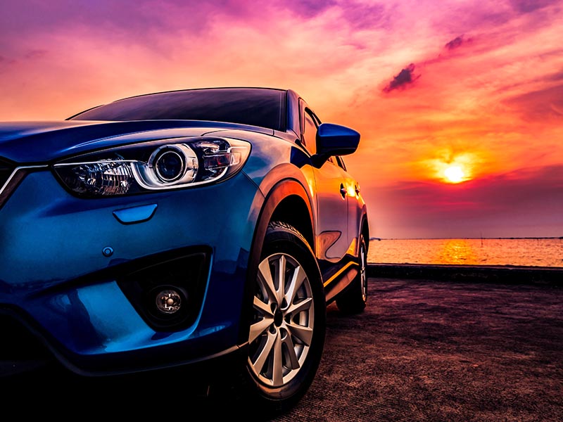 image of sports car at sunset 
