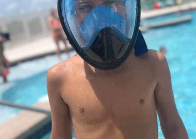 child with swimming goggles